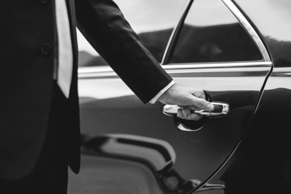 Businessman Handle Limousine Door Car